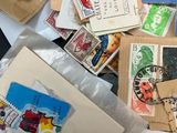 many different types of stamps on the table