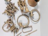 a lot of brass items that are on a table
