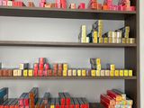 a shelf with many different types of cigarettes on it