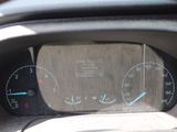 a close up of a car dashboard with a speedometer and gauges