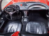 a red sports car with black leather seats and a steering wheel