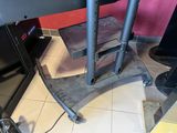 a television stand with a television on top of it