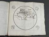 an old book with a map of the world on it
