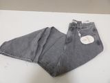 the jeans are on the table with a price tag on it