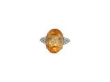 an orange sapphire and diamond ring