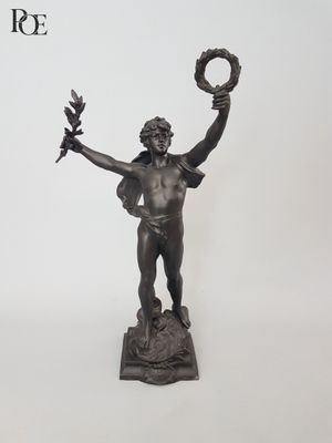 a statue of a man holding a wreath and a bird