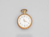 a small gold pocket watch with a white face