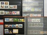 many different types of stamps on display in a display case