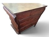 an old wooden chest of drawers with a marble top