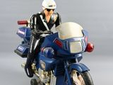 a figurine of a man on a motorcycle with a helmet on