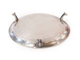 a silver plate with a handle on a white background