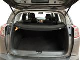 the back of a car with its trunk open and the back seats folded down