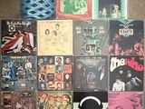 a lot of records on a table with a basketball ball