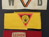 three pieces of cloth with different designs on them on a black surface