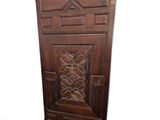 a wooden chair with a carved design on the back