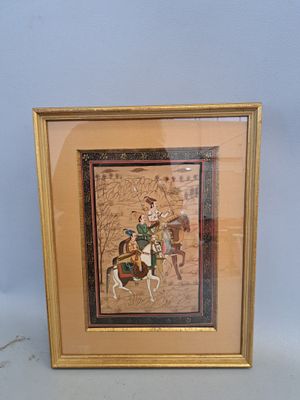 framed picture of a man riding a horse with a woman on it