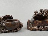 pair of chinese carved wood bowls with birds and flowers on them