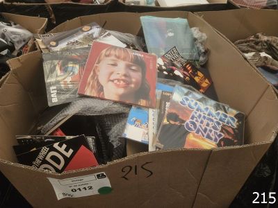 a cardboard box full of dvds and other movies