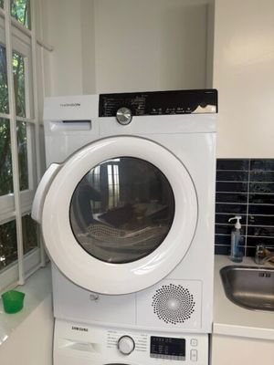 a white washer and dryer in a small kitchen