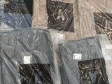 many different types of shirts wrapped in plastic