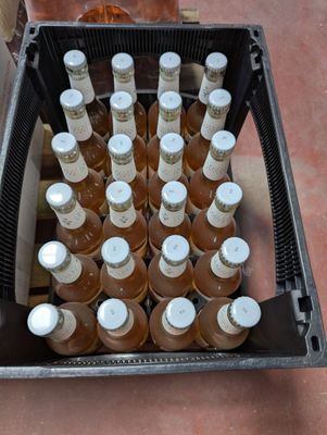 many bottles of beer in a black case on the floor