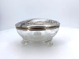 an image of a silver plate with a lid on a white table