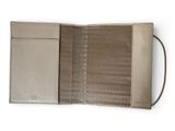 a close up of a wallet on a white surface