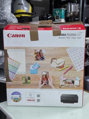 une photo d'une imprimante photo Canon dans son emballage