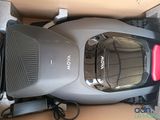 a vacuum that is sitting in a box on the floor