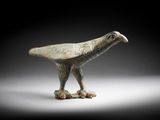 figurine en bronze représentant un oiseau perché sur une branche