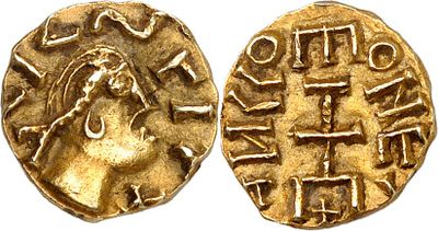 a gold coin with an image of a woman on it