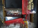 a box of assorted toy cars and other items in it