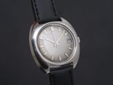a close up of a watch with roman numerals on the face