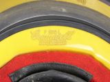 a close up of a tire with a red and yellow cover