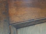 a close up of a wooden door with a handle on it
