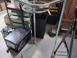 a table with a glass top on a cart in a room