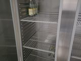 an image of a refrigerator with a bottle of wine inside of it