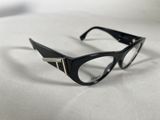 black cat eye glasses on a white surface with a white background