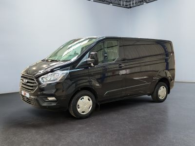 the black van is parked in a large room with a white wall