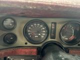 a close up of a dashboard of a car with gauges