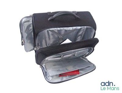 une image représentant une valise noire avec une poignée rouge