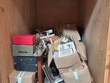 a small wooden box filled with boxes and other items