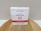a box of japanese food sitting on top of a wooden table