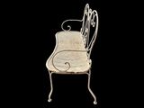 a white chair that is sitting on a black background