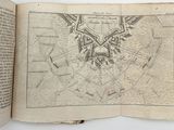 an open book with a map of the city of london on it
