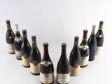 several bottles of wine are arranged in a circle on a white surface