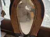 a mirror that is sitting on the floor next to a window