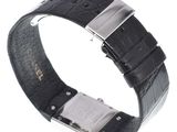 a close up of a black leather watch band with a silver buckle