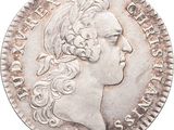 a close up of a coin with a woman ' s head on it