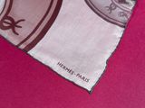 a scarf with a picture of a horse and a shield on it
